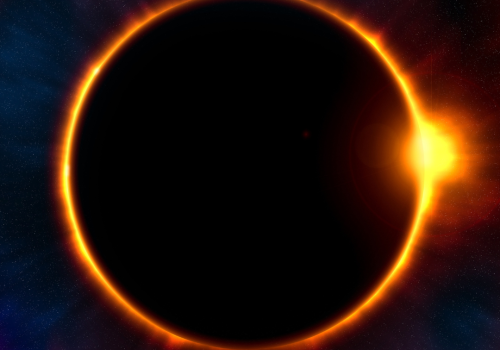 The image depicts a solar eclipse with the bright corona of the sun visible around the dark silhouette of the moon against a colorful cosmic background.