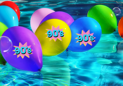 This image shows colorful balloons floating in a pool, with several balloons displaying the text 