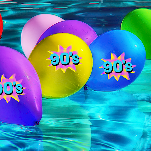 This image shows colorful balloons floating in a pool, with several balloons displaying the text 